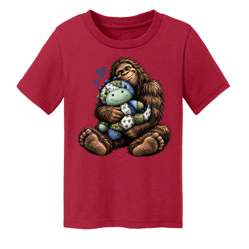 Red - Bigfoot hugging a patchwork dinosaur toddler tee - FRONT
